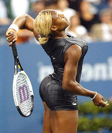 Serena Williams playing tennis in black dress